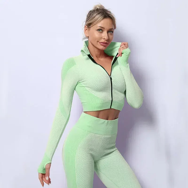 Stylish mesh sports crop top in mint green, perfect for workouts or casual athleisure looks.