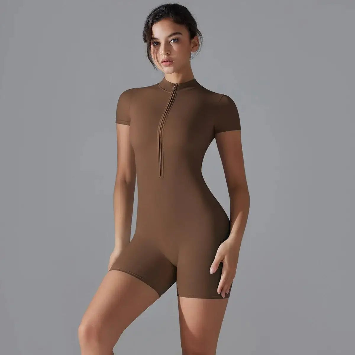 Woman in a brown VivaSculpt FitOne Suit showcasing slim fit and high stretch fabric.