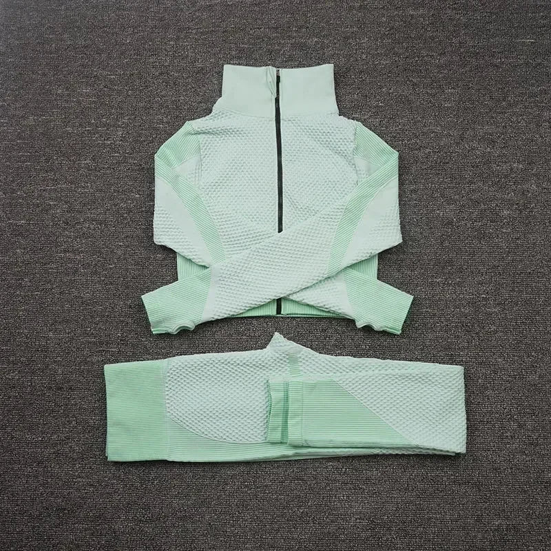 Light green mesh sports crop top and matching leggings, designed for breathability and comfort during workouts.