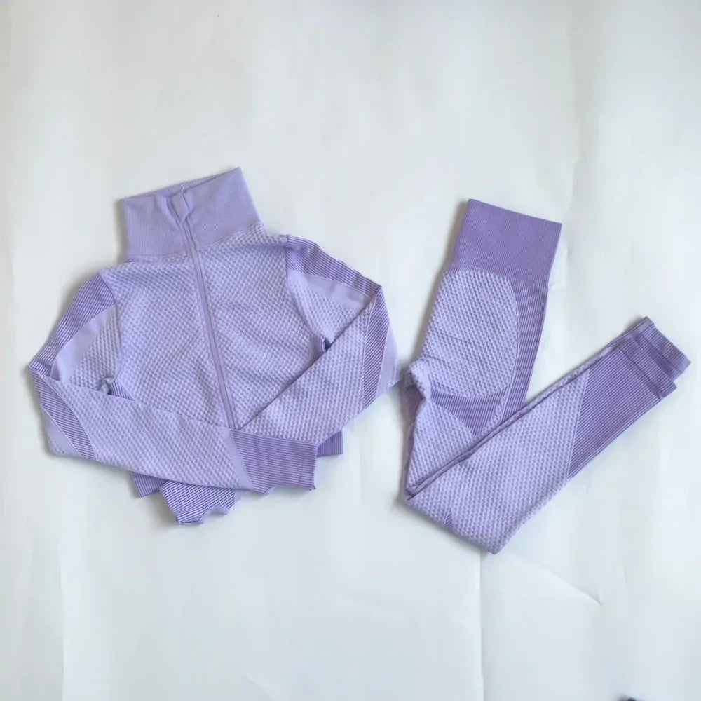 Purple mesh sports crop top and leggings set, perfect for workouts and athleisure style.