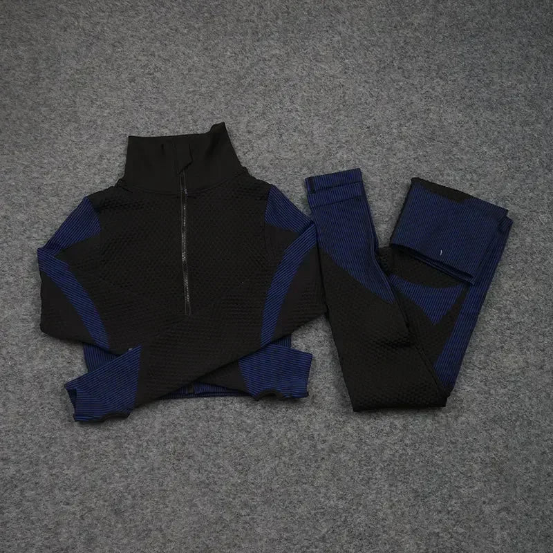 Mesh sports crop top and leggings set in black and blue, ideal for workouts and athleisure. Breathable and stylish design.