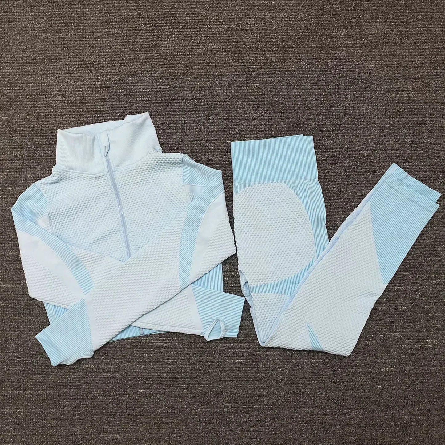 Light blue mesh sports crop top and leggings set for women, ideal for workouts and athleisure wear.