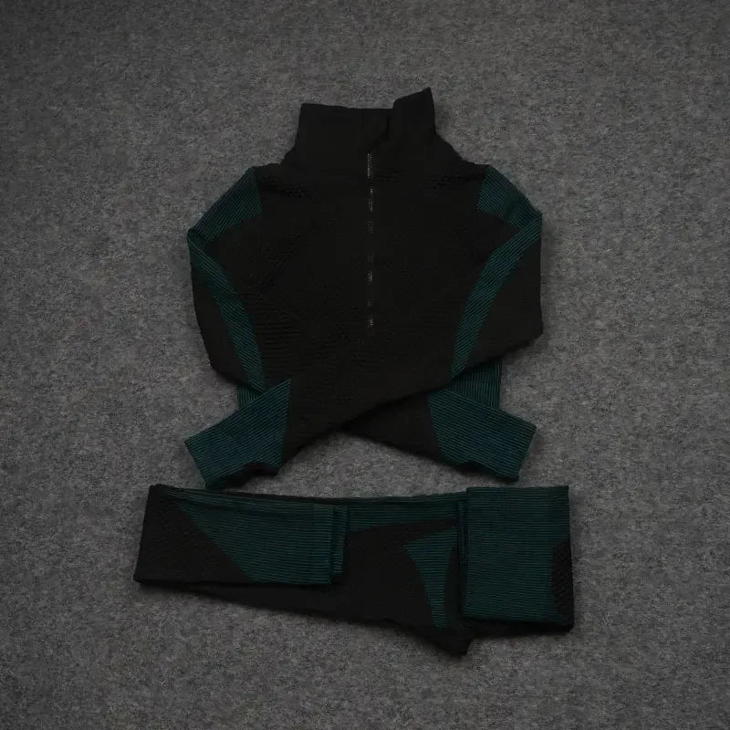 Mesh sports crop top and matching leggings in black and teal, perfect for workouts and athleisure style.