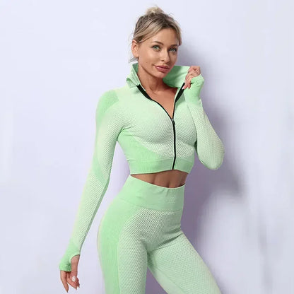 Stylish mesh sports crop top in mint green, perfect for workouts or casual athleisure looks.