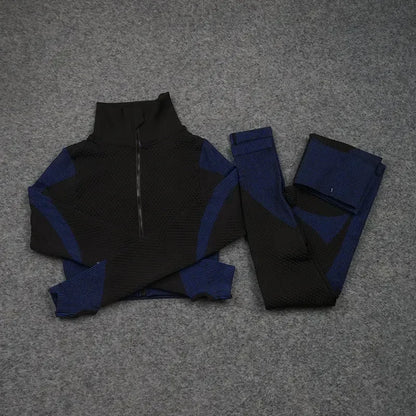 Mesh sports crop top and leggings set in black and blue, ideal for workouts and athleisure. Breathable and stylish design.