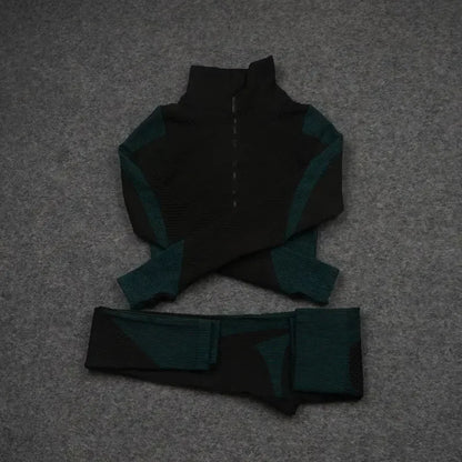 Mesh sports crop top and matching leggings in black and teal, perfect for workouts and athleisure style.